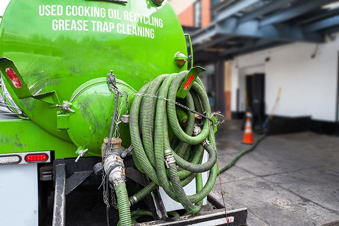 grease trap pumping truck in action in Antioch, IL